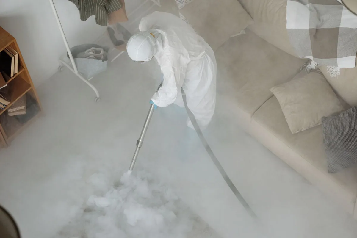 Biohazard cleanup technician in protective equipment, Glouster, OH